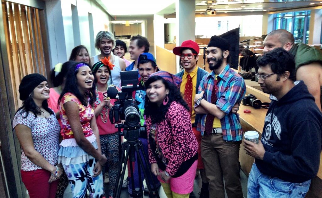 Cast watching playbacks of the filming